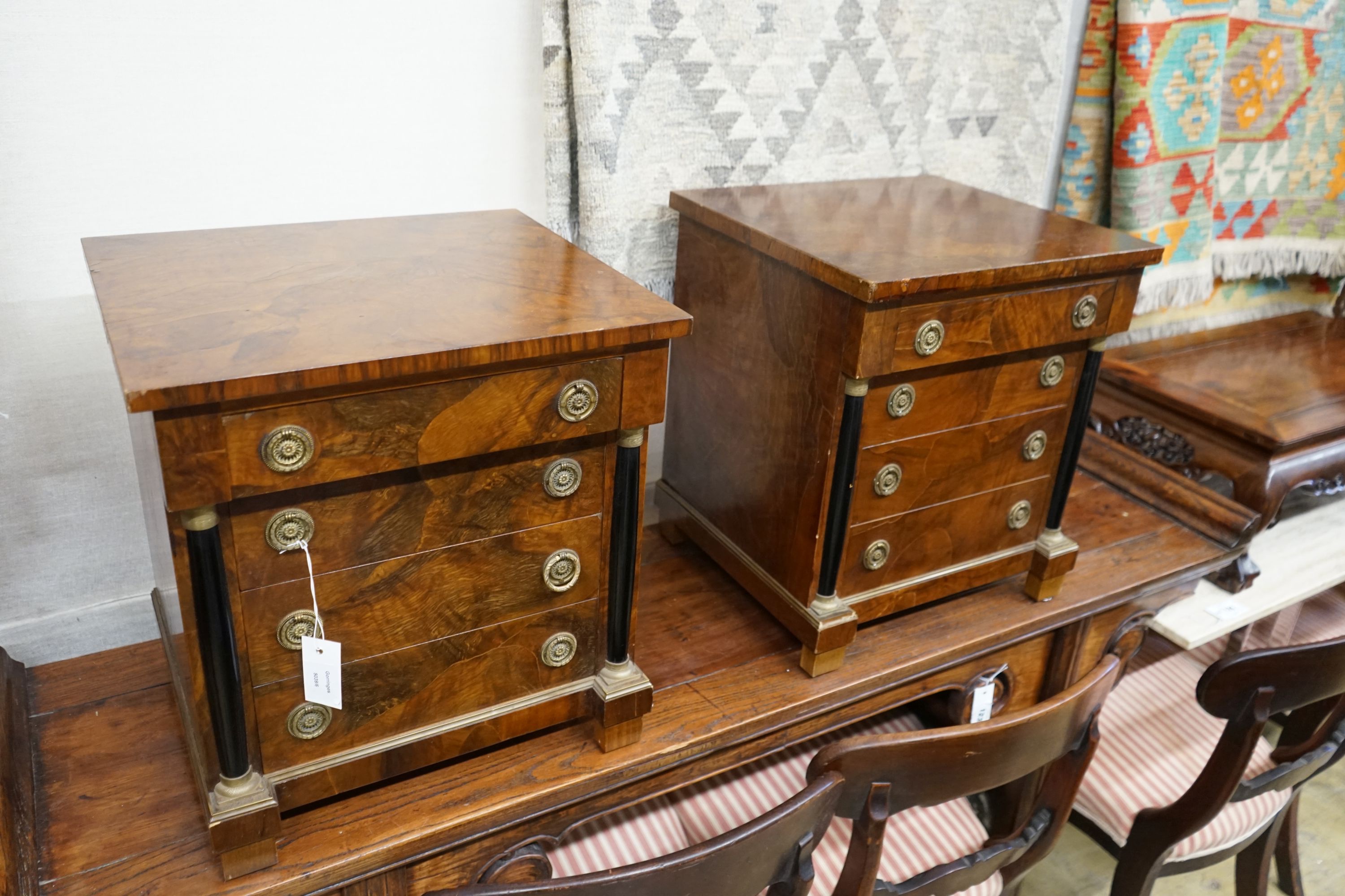 A pair of Biedermeier style walnut four drawer bedside chests, width 45cm, depth 40cm, height 48cm
